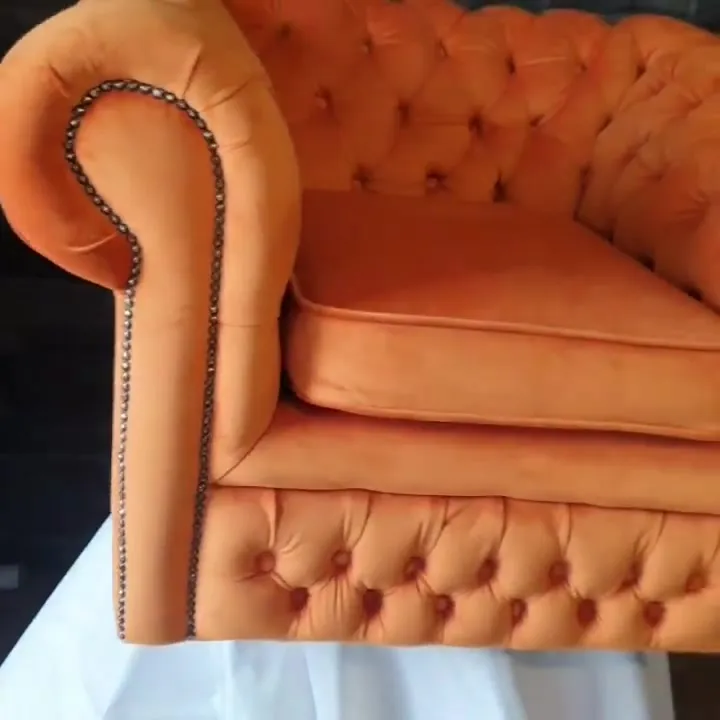 Chesterfield rolled arm with brass stud detail