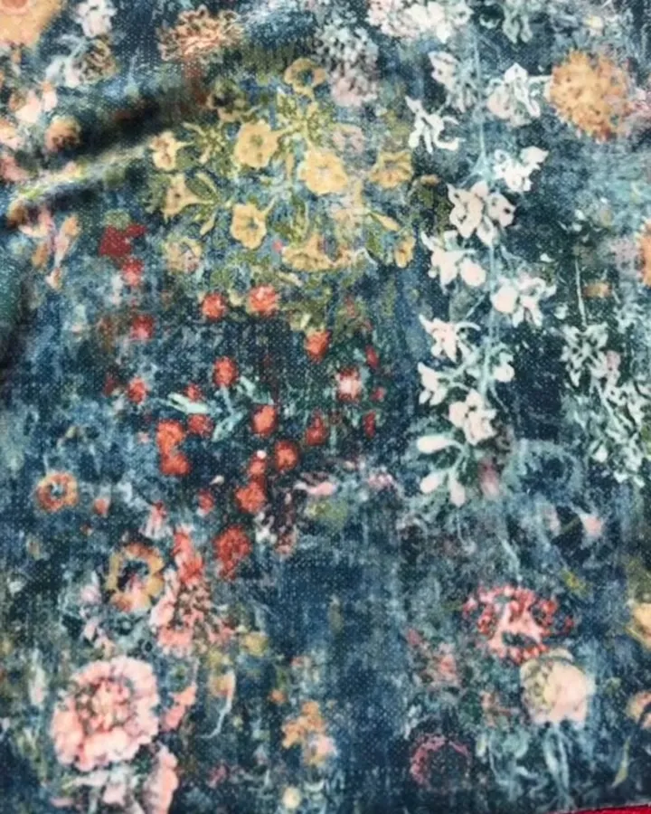 Close-up of a dark floral velvet upholstery fabric
